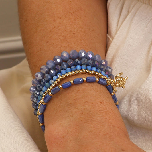 Blue and gold bead bracelet stack with sea turtle